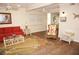 A cozy living room features a ceiling fan and a coastal-themed rug, sofa, and furnishings at 21535 Edgewater Dr, Port Charlotte, FL 33952