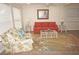 Bright living room with multiple ceiling fans, coastal decor, and neutral walls at 21535 Edgewater Dr, Port Charlotte, FL 33952