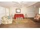 Bright living room with multiple ceiling fans, coastal decor, and neutral walls at 21535 Edgewater Dr, Port Charlotte, FL 33952