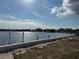 Scenic waterfront view showcasing a concrete seawall and serene canal waters at 21535 Edgewater Dr, Port Charlotte, FL 33952