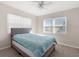 Sunlit bedroom with a plush bed, and large windows offering serene views of the outdoors at 21923 Cellini Ave, Port Charlotte, FL 33952
