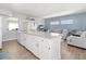 Modern kitchen with granite countertops and seamless open layout to living area, perfect for entertaining at 21923 Cellini Ave, Port Charlotte, FL 33952