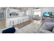 Bright living space with a view of the updated kitchen and a comfortable seating area at 21923 Cellini Ave, Port Charlotte, FL 33952