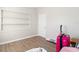 Bright room with wood floors and built-in shelving, offering versatile use at 21923 Cellini Ave, Port Charlotte, FL 33952