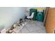A messy storage room with cans of paint and trash containers at 21923 Cellini Ave, Port Charlotte, FL 33952