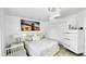 Spacious bedroom with a queen-size bed and white dresser at 2325 Hanford Ln, North Port, FL 34288