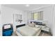 Bedroom with a full-size bed and white dresser at 2325 Hanford Ln, North Port, FL 34288