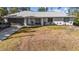Charming single-story home with a two-car garage, a well-kept lawn, and cozy front porch at 2325 Hanford Ln, North Port, FL 34288
