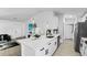 Clean and bright kitchen with modern appliances and white cabinetry at 2325 Hanford Ln, North Port, FL 34288