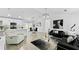 Open-concept living room with modern furniture and large TV at 2325 Hanford Ln, North Port, FL 34288
