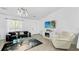 Bright living room featuring modern decor and a sleek entertainment center at 2325 Hanford Ln, North Port, FL 34288