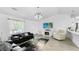 Spacious living area with a large TV and comfortable furniture at 2325 Hanford Ln, North Port, FL 34288