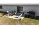Outdoor patio with seating area and built-in gas grill at 2325 Hanford Ln, North Port, FL 34288