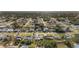 Expansive aerial view of a neighborhood featuring single-Gathering homes with well-maintained lawns and tree-lined streets at 2443 Lake View Blvd, Port Charlotte, FL 33948