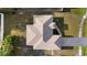 An aerial view displays the beautiful roof, landscaping and driveway of this home at 2443 Lake View Blvd, Port Charlotte, FL 33948