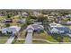 This home has great curb appeal, with a long driveway, well-manicured lawn and mature trees at 2443 Lake View Blvd, Port Charlotte, FL 33948