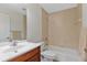 Bathroom with tiled walls, neutral color scheme, vanity sink, and a combined shower and tub at 2443 Lake View Blvd, Port Charlotte, FL 33948