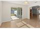 Dining area with tile flooring and sliding glass doors to a patio, connecting the indoors with the outdoors at 2443 Lake View Blvd, Port Charlotte, FL 33948