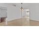 Dining room with tile flooring, a view into other rooms, and hanging light fixture at 2443 Lake View Blvd, Port Charlotte, FL 33948