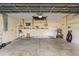 Spacious garage featuring a concrete floor, overhead storage racks, and ample space for parking and storage at 2443 Lake View Blvd, Port Charlotte, FL 33948