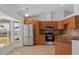Modern kitchen with stainless steel appliances, ample cabinet space, and a large window overlooking the yard at 2443 Lake View Blvd, Port Charlotte, FL 33948
