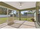 A lovely screened-in patio offers views of the backyard, and tiled floors for easy maintenance at 2443 Lake View Blvd, Port Charlotte, FL 33948