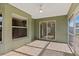 An attractive screened-in patio has sliding doors to the interior, and backyard access at 2443 Lake View Blvd, Port Charlotte, FL 33948