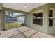 This home features a screened-in patio overlooking the backyard at 2443 Lake View Blvd, Port Charlotte, FL 33948
