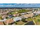 Nice aerial of neighborhood homes showing the community landscaping and scenic ponds, some homes with solar panels at 24576 Buckingham Way, Punta Gorda, FL 33980