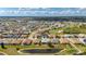 Overhead shot shows the house near a pond and golf course in a desirable neighborhood at 24576 Buckingham Way, Punta Gorda, FL 33980