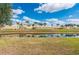 Pond view from backyard provides a tranquil and scenic backdrop at 24576 Buckingham Way, Punta Gorda, FL 33980