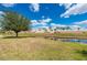 Beautiful water view from the property enhances the backyard's serene and picturesque setting at 24576 Buckingham Way, Punta Gorda, FL 33980