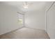 Bedroom featuring a ceiling fan, a window, and closet space at 24576 Buckingham Way, Punta Gorda, FL 33980