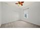 Bedroom featuring a ceiling fan, a window, and closet space at 24576 Buckingham Way, Punta Gorda, FL 33980