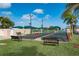Bocce ball courts with lakeside views and benches, a great place to relax and play at 24576 Buckingham Way, Punta Gorda, FL 33980