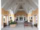 Community center entrance with benches, planters, and holiday decorations at 24576 Buckingham Way, Punta Gorda, FL 33980