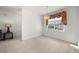 Bright, empty room with neutral walls, carpeted floors, and a window that lets in plenty of sunlight at 24576 Buckingham Way, Punta Gorda, FL 33980