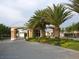 Palm-lined entrance gate providing 24 hour security for peace of mind at 24576 Buckingham Way, Punta Gorda, FL 33980