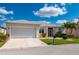 Beautiful single-story home with a two-car garage and a lush green lawn at 24576 Buckingham Way, Punta Gorda, FL 33980