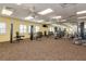 Bright community gym with modern equipment and mirrors, perfect for staying active at 24576 Buckingham Way, Punta Gorda, FL 33980