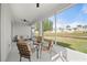 Inviting lanai space with seating arrangement to enjoy the outdoor views at 24576 Buckingham Way, Punta Gorda, FL 33980