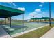 A view of the shuffleboard court and surrounding lakeside community at 24576 Buckingham Way, Punta Gorda, FL 33980