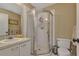 Bathroom with tile shower, vanity, sink, and toilet; perfect for guests at 25100 Sandhill Blvd # J-201, Punta Gorda, FL 33983