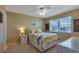 This bright bedroom features a queen bed and a window with a view of the neighborhood at 25100 Sandhill Blvd # J-201, Punta Gorda, FL 33983