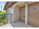 Inviting condo entryway featuring a secure front door and neutral color scheme at 25100 Sandhill Blvd # J-201, Punta Gorda, FL 33983