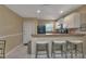 This well-lit kitchen features white cabinets, a breakfast bar, and stainless steel appliances at 25100 Sandhill Blvd # J-201, Punta Gorda, FL 33983
