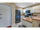 This well-lit kitchen features white cabinets and stainless steel appliances at 25100 Sandhill Blvd # J-201, Punta Gorda, FL 33983