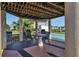 A pleasant outdoor kitchen area with grills, tables, and lighting for entertaining at 25100 Sandhill Blvd # J-201, Punta Gorda, FL 33983