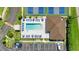 Aerial view of the community pool and amenities with plenty of seating and a cabana at 25100 Sandhill Blvd # J-201, Punta Gorda, FL 33983
