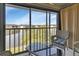 Relaxing screened porch with lake views and comfortable seating at 25100 Sandhill Blvd # J-201, Punta Gorda, FL 33983